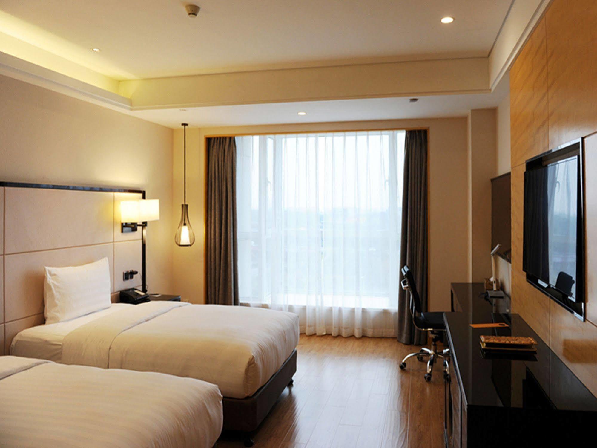Hotel Pullman Qingdao Ziyue Extérieur photo